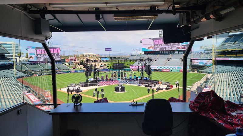 A broadcast booth overlooking a stadium event