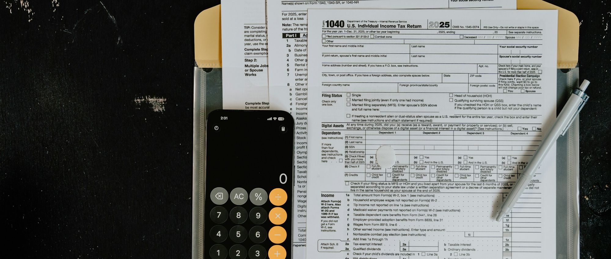 A blank Form 1040 and other tax forms beside a calculator